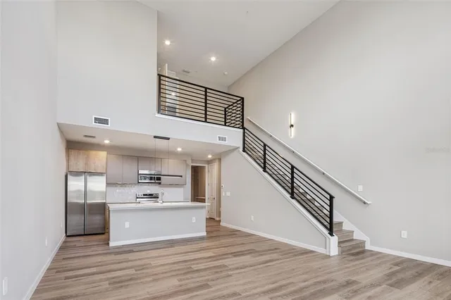 a view of kitchen with cabinets and wooden floor