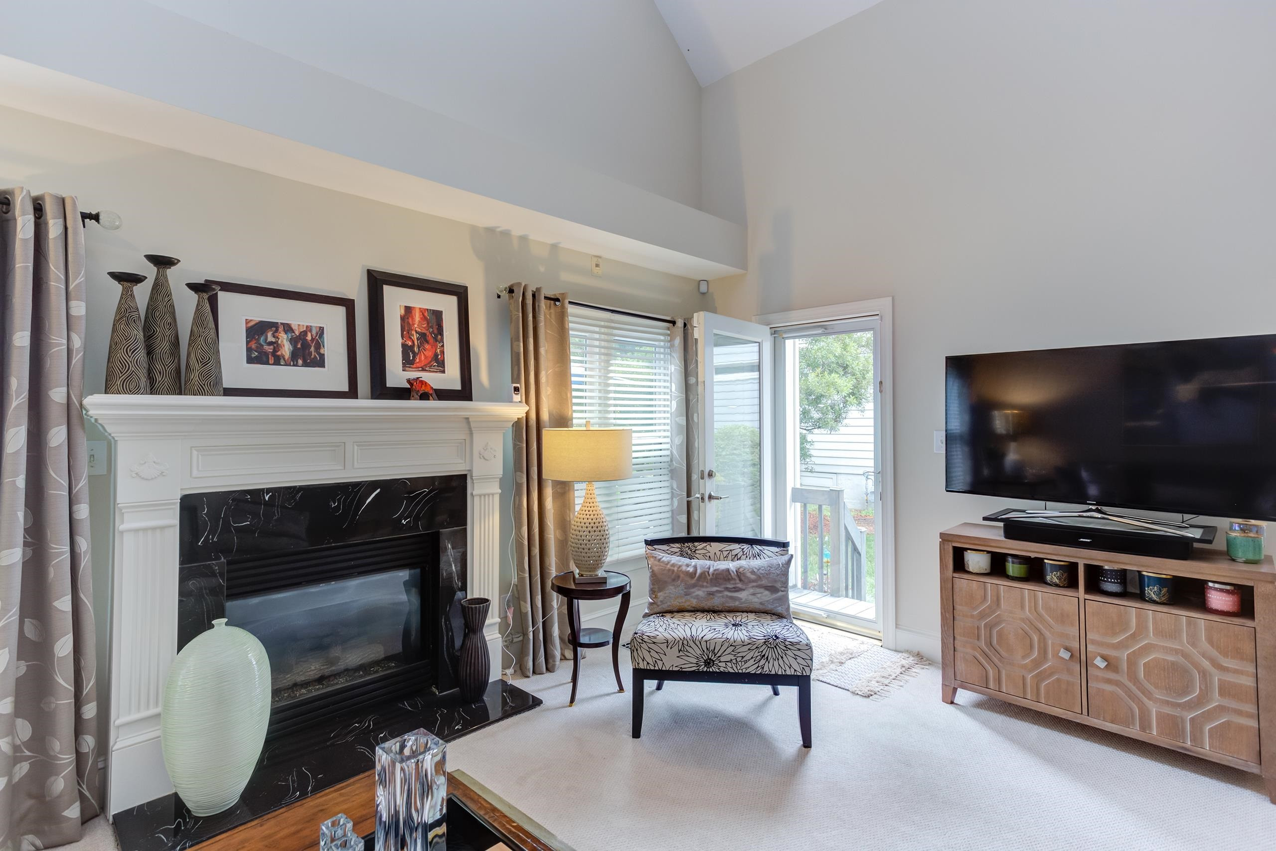 2913 Hawtree Drive Raleigh, NC 27613 - Photo 14 of 28 This striking room is a great place to relax, but also provides access to the back deck for an easy flow from inside to out. Den/Family/Great Room