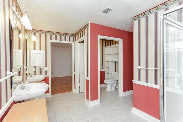 a very nice looking room with a large window and a couch