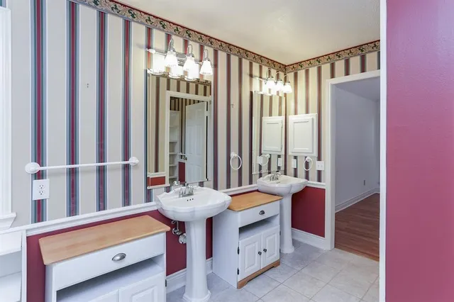 a bathroom with a sink a mirror and a bathtub