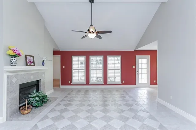 a view of an empty room with a fireplace