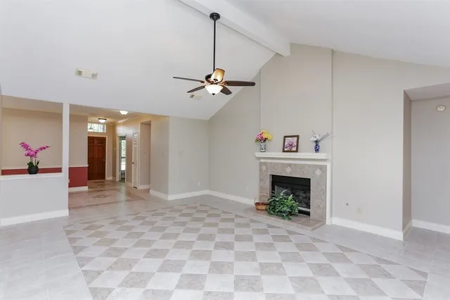 a view of an empty room with a fireplace