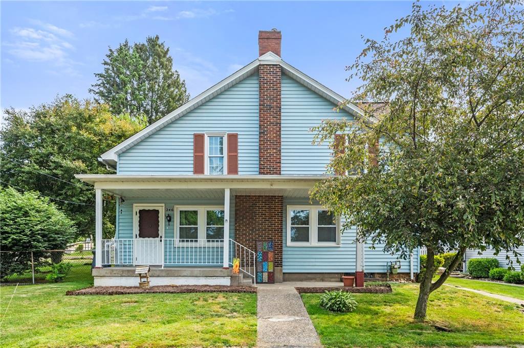 246 Olive Street Hunker, PA 15639 - Photo 1 of 27 a front view of a house with a yard