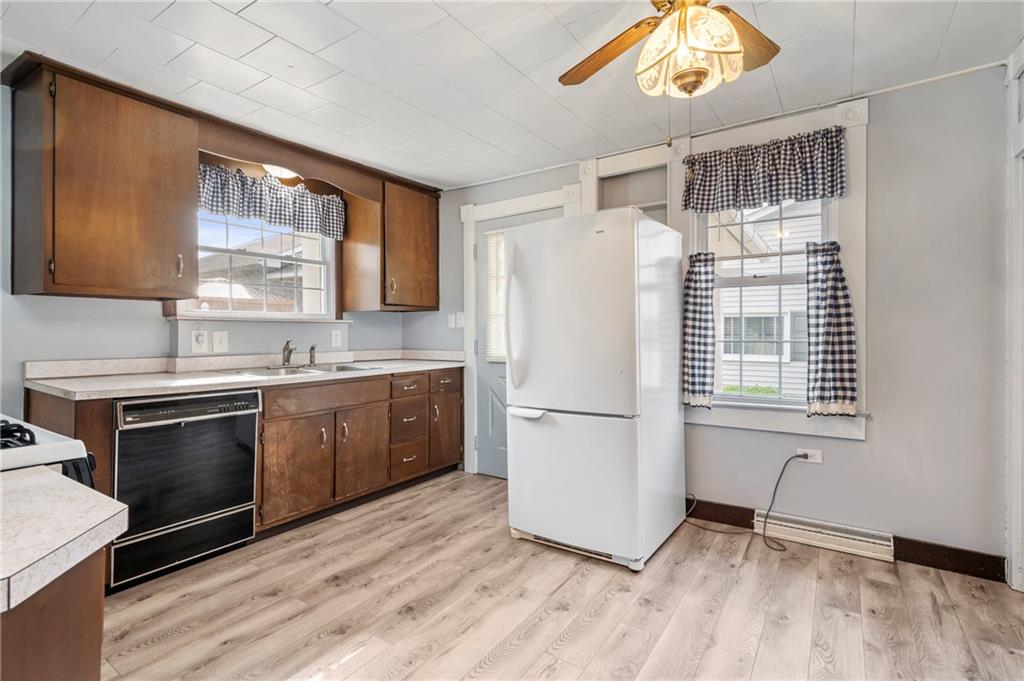 246 Olive Street Hunker, PA 15639 - Photo 12 of 27 a kitchen with a refrigerator sink and cabinets