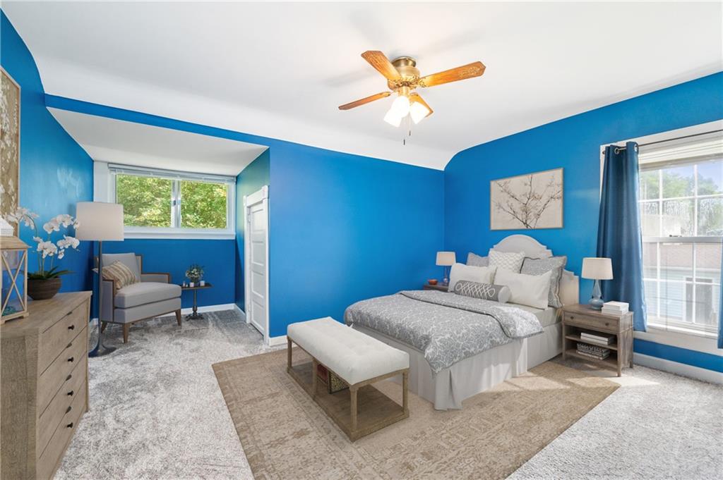 246 Olive Street Hunker, PA 15639 - Photo 16 of 27 a bedroom with a bed and a chandelier
