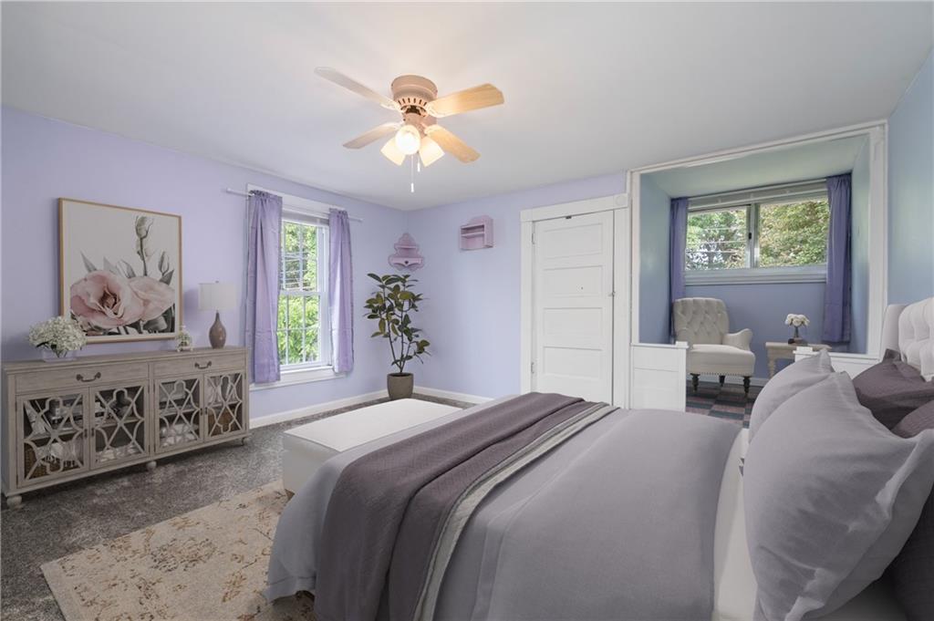 246 Olive Street Hunker, PA 15639 - Photo 18 of 27 a bedroom with a large bed and a chandelier