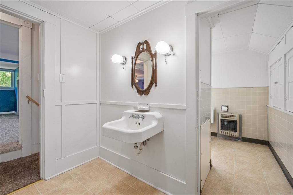 246 Olive Street Hunker, PA 15639 - Photo 19 of 27 a bathroom with a sink and a mirror