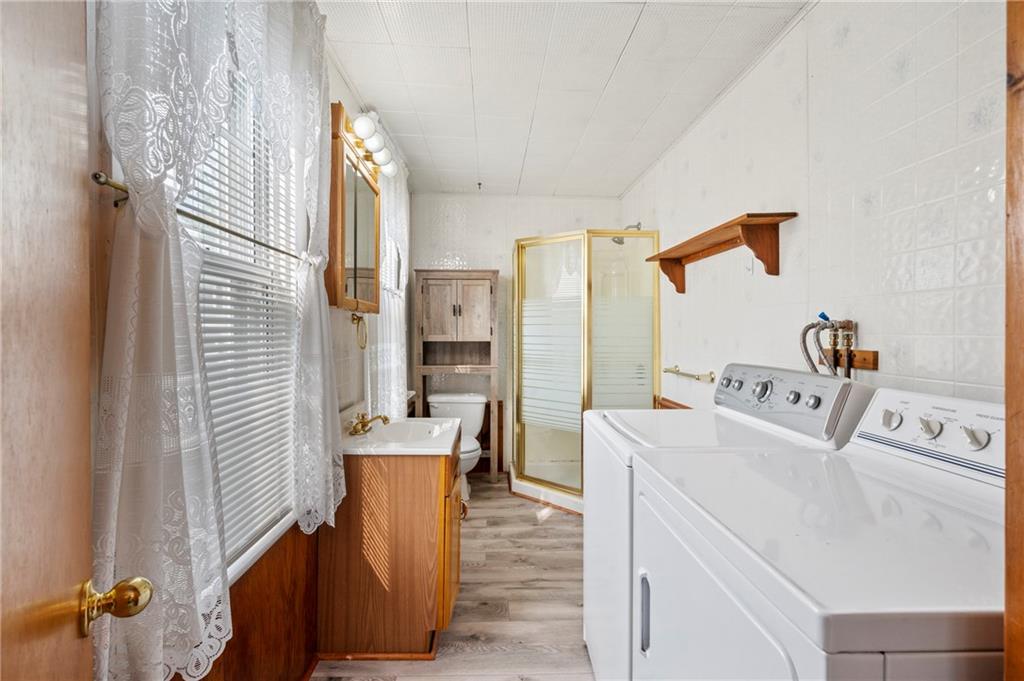 246 Olive Street Hunker, PA 15639 - Photo 21 of 27 a room with a sink and washing machine