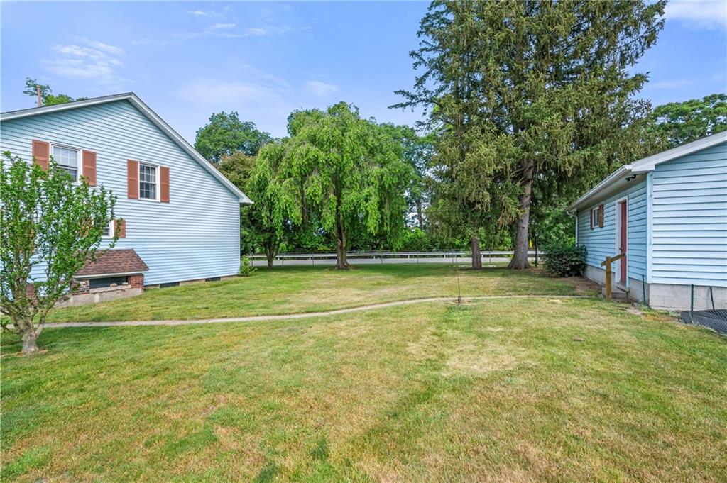 246 Olive Street Hunker, PA 15639 - Photo 23 of 27 a view of a house with a backyard and a patio