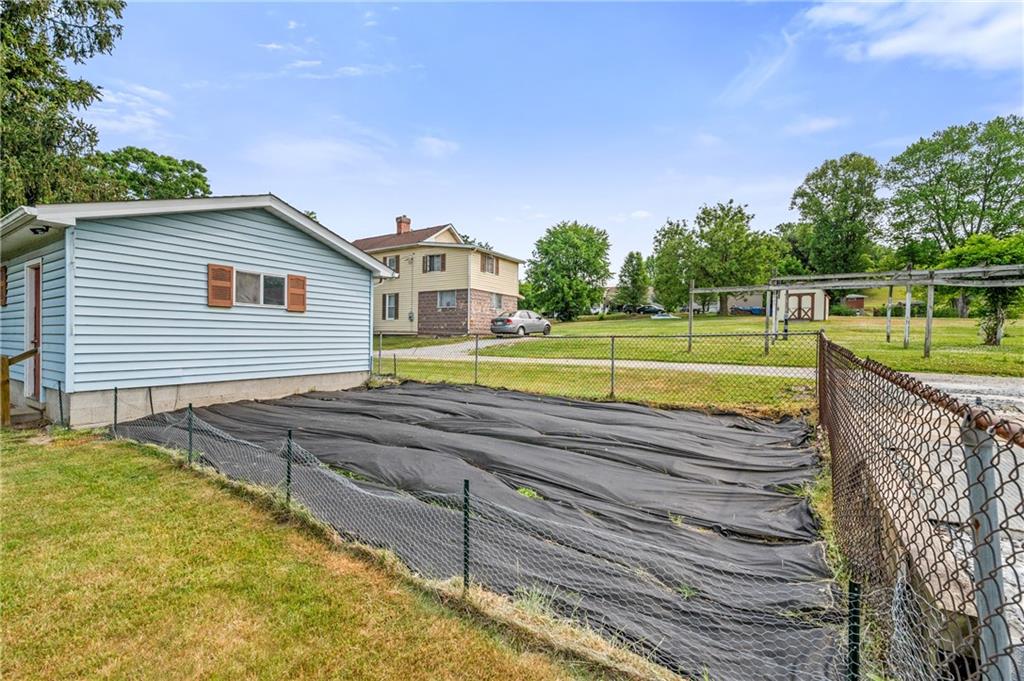 246 Olive Street Hunker, PA 15639 - Photo 25 of 27 a view of a house with a backyard and a lake view