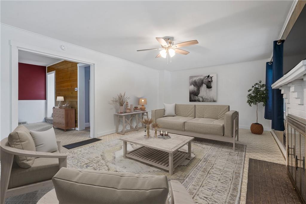 246 Olive Street Hunker, PA 15639 - Photo 6 of 27 a living room with furniture and a flat screen tv