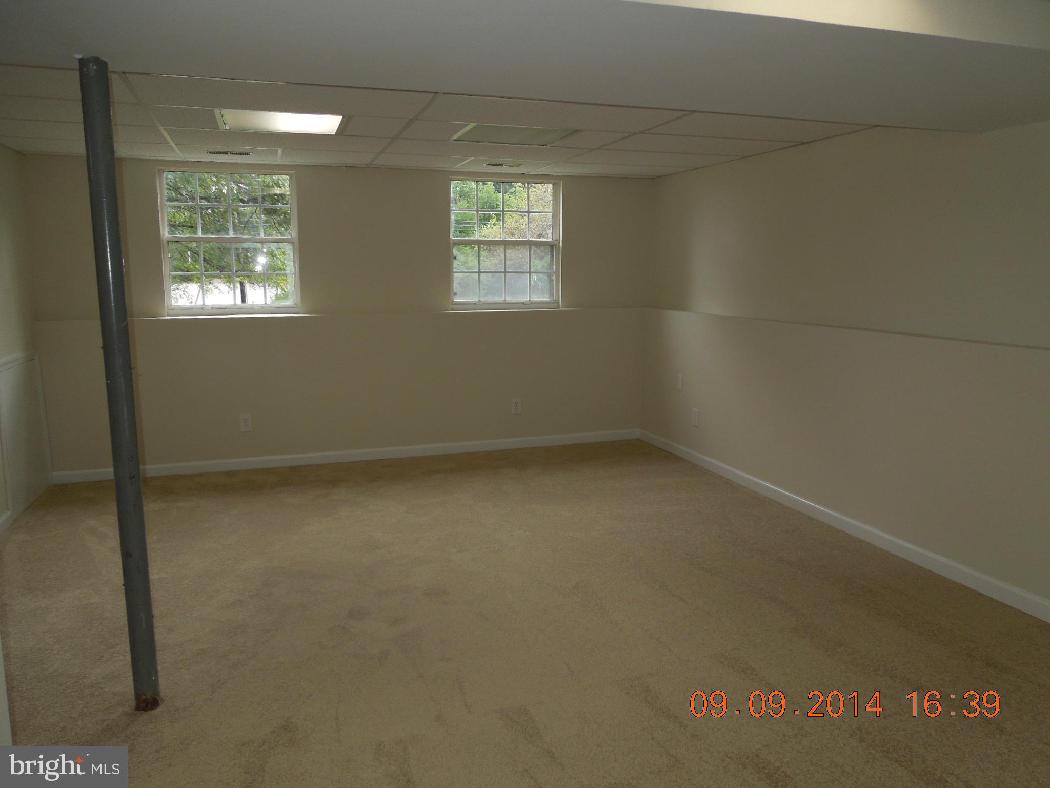 7030 Johnnycake Road Baltimore, MD 21228 - Photo 14 of 22 an empty room with windows