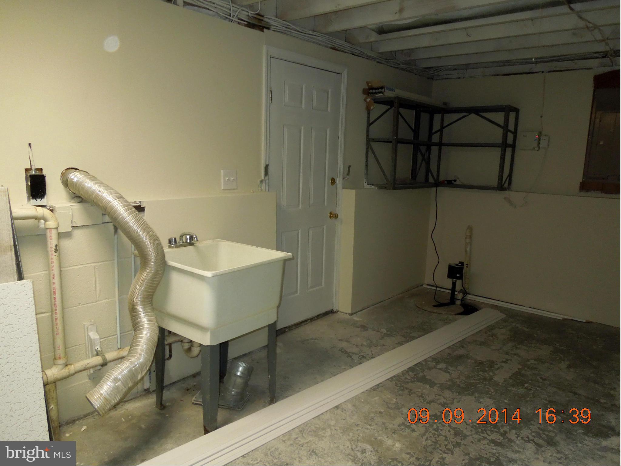 7030 Johnnycake Road Baltimore, MD 21228 - Photo 15 of 22 a bathroom with a sink and mirror