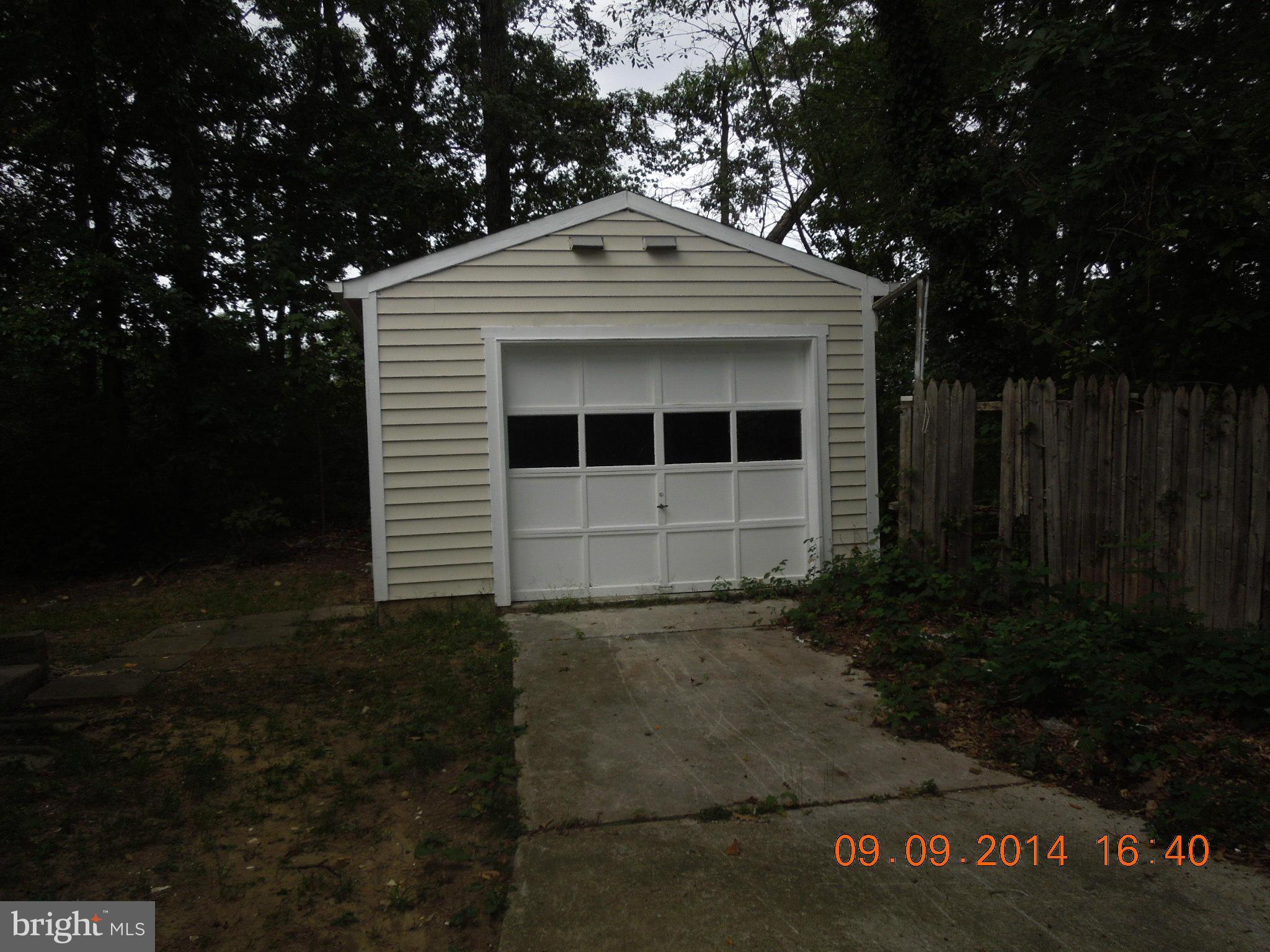 7030 Johnnycake Road Baltimore, MD 21228 - Photo 18 of 22 a front view of a house with a yard