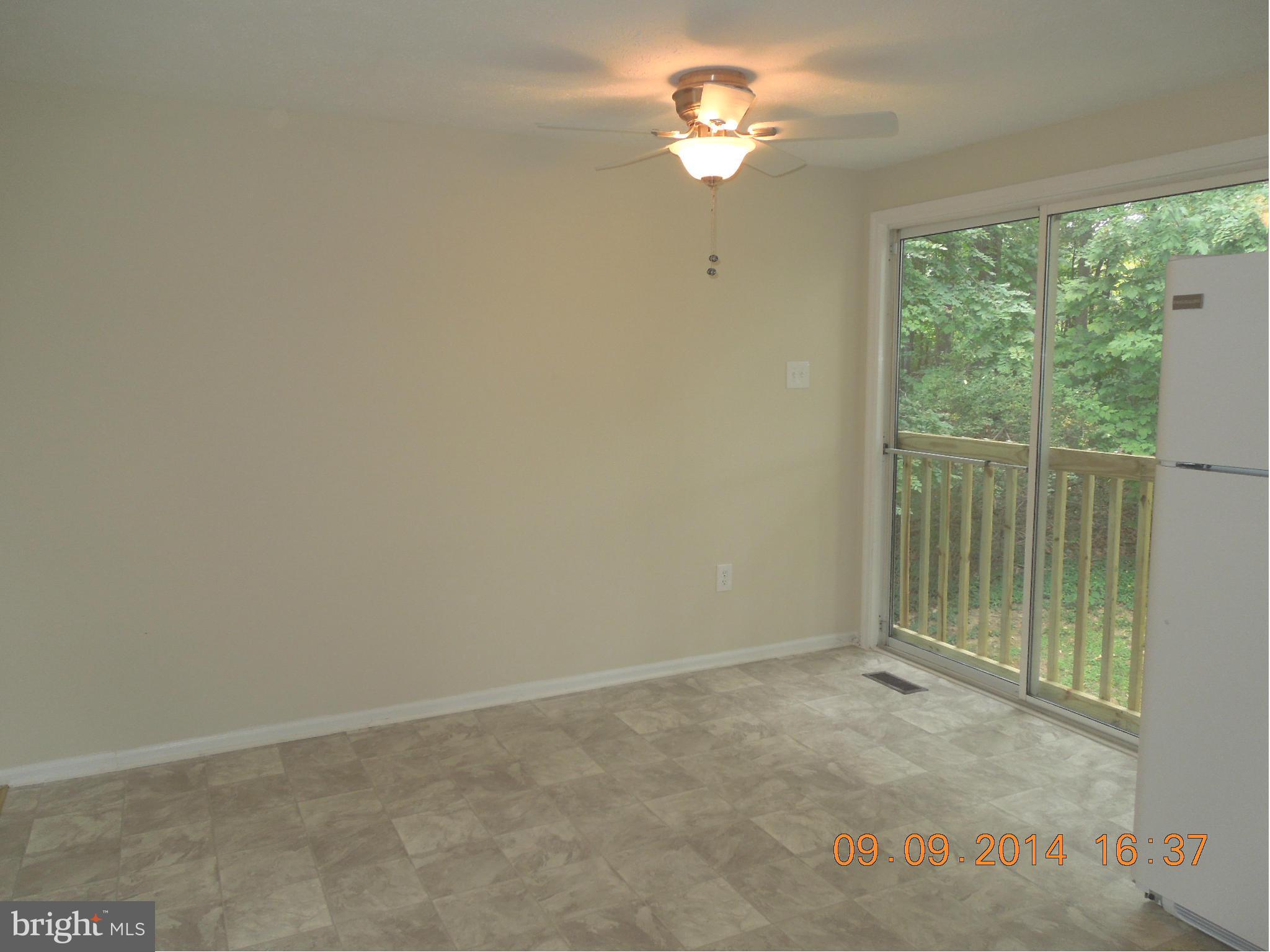 7030 Johnnycake Road Baltimore, MD 21228 - Photo 5 of 22 an empty room with a window