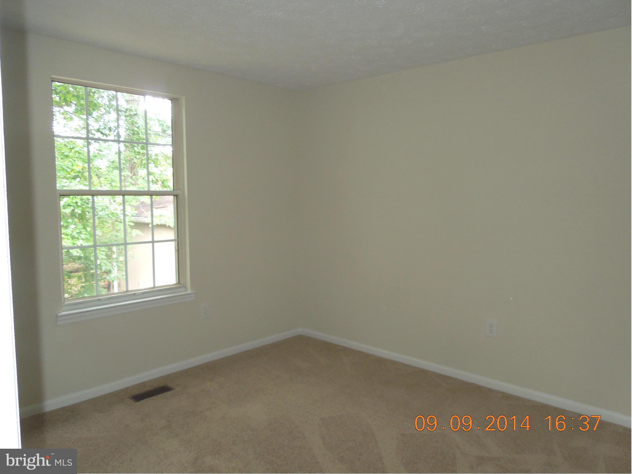 7030 Johnnycake Road Baltimore, MD 21228 - Photo 7 of 22 an empty room with a window