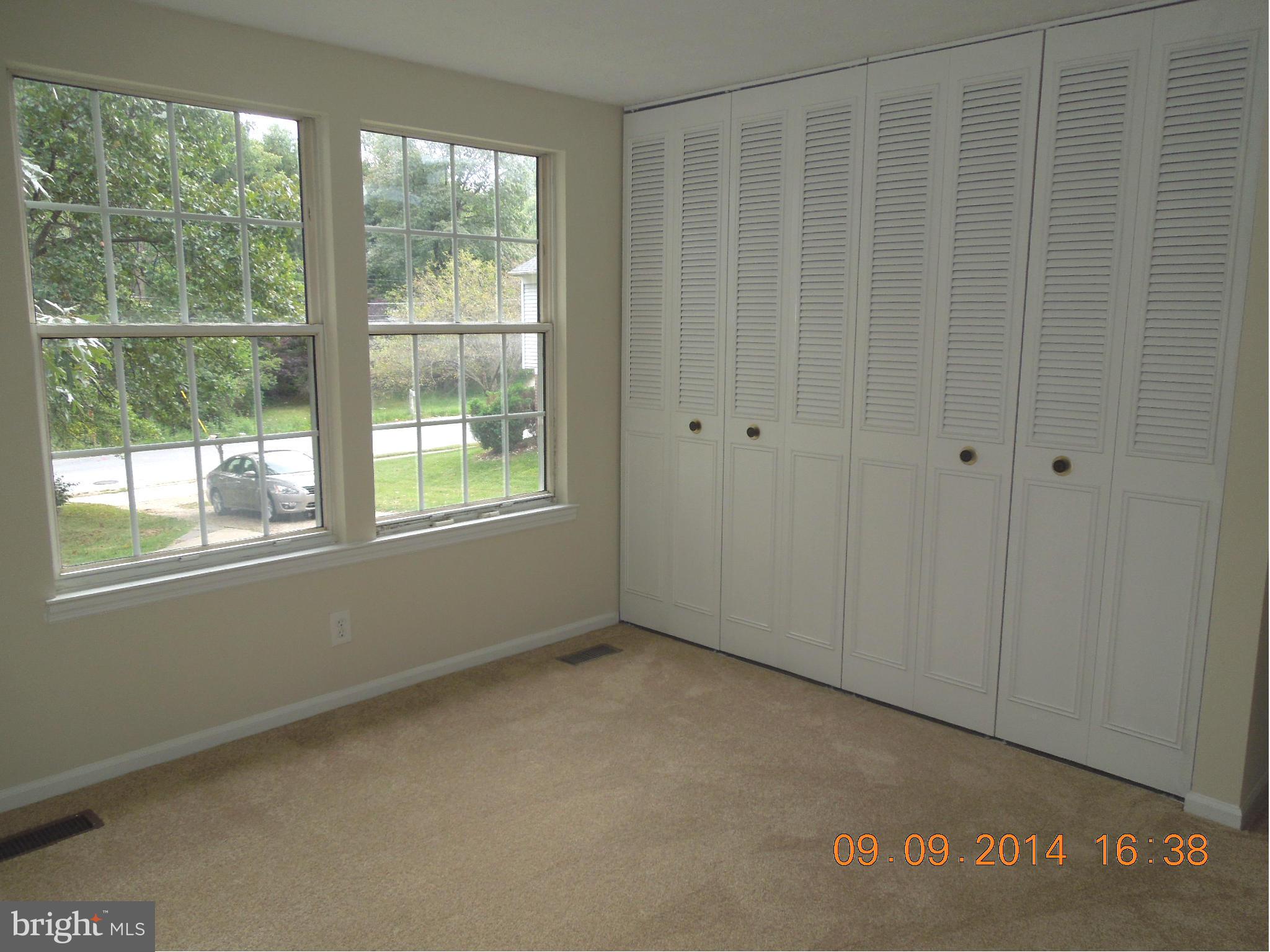 7030 Johnnycake Road Baltimore, MD 21228 - Photo 8 of 22 a view of an empty room with a window