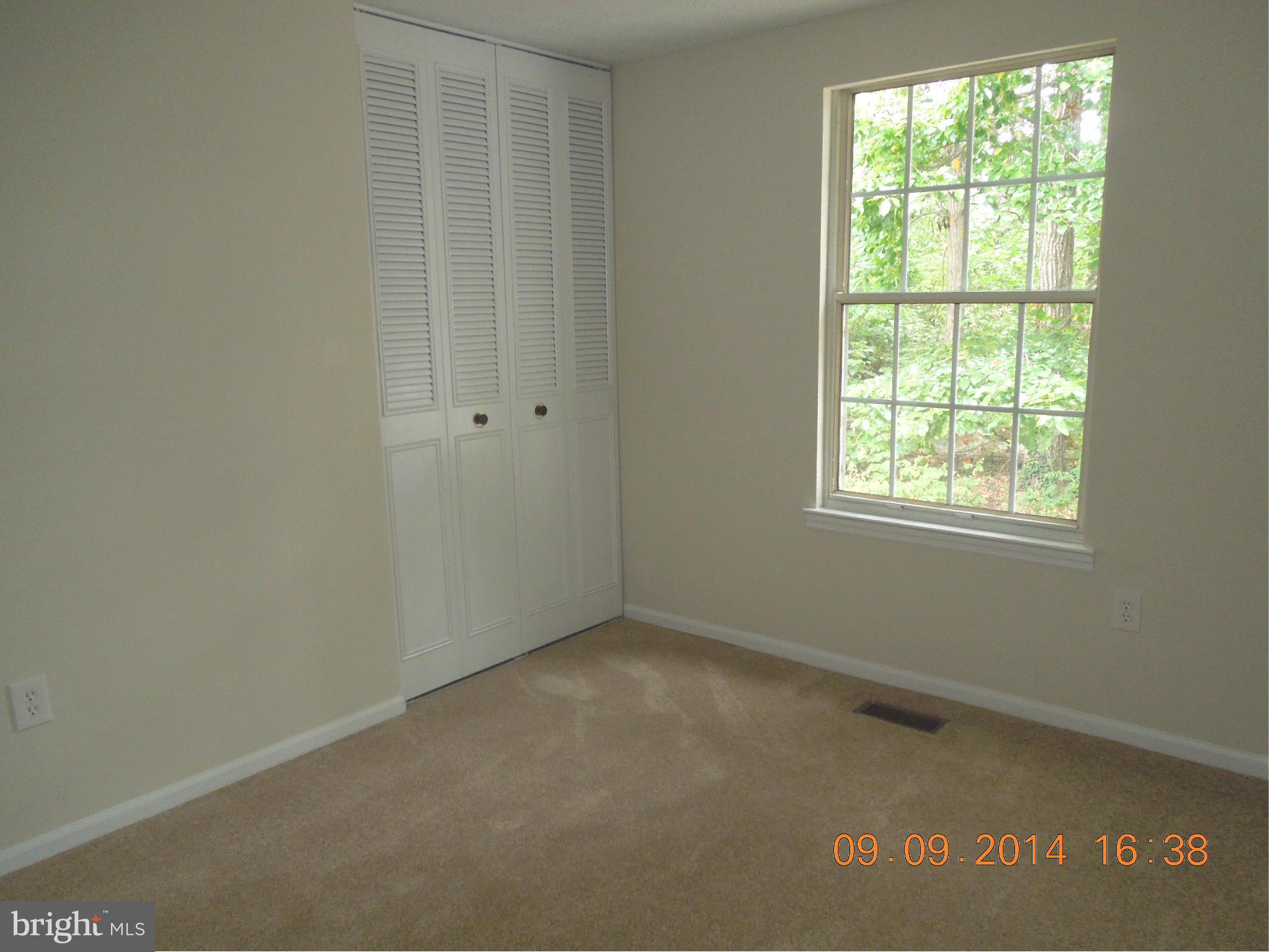 7030 Johnnycake Road Baltimore, MD 21228 - Photo 9 of 22 an empty room with a window