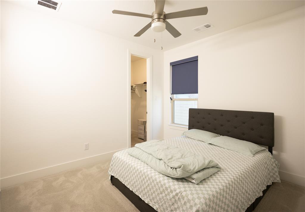 3017 Andorra Road McKinney, TX 75071 - Photo 24 of 40 Plush carpet flooring, recessed window with roller shade, ceiling fan with integrated lighting, and a closet with shelving