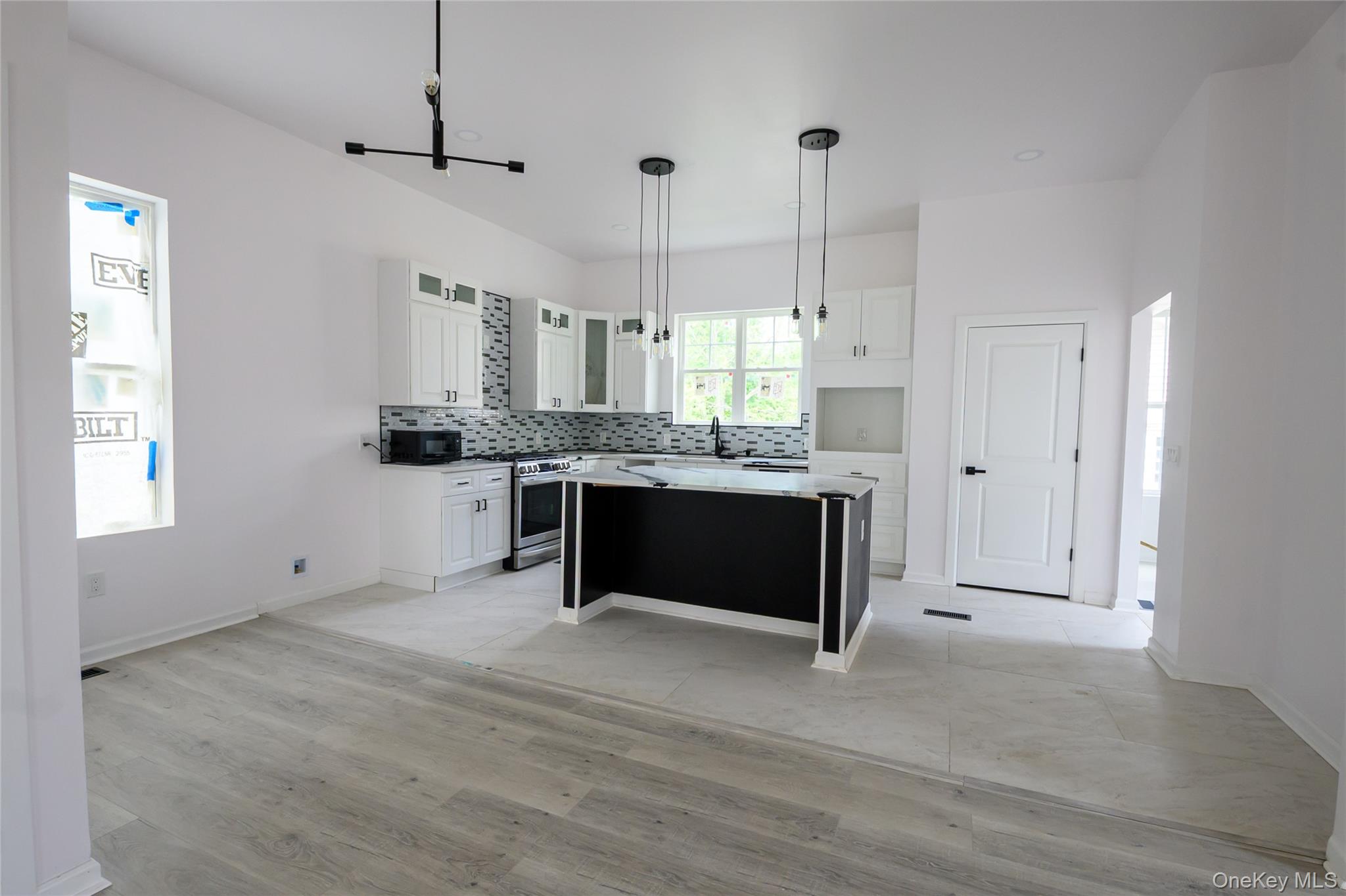 81 Silver Lake Sctn Road Middletown, NY 10940 - Photo 5 of 37 a kitchen with stainless steel appliances granite countertop a stove a sink and a refrigerator