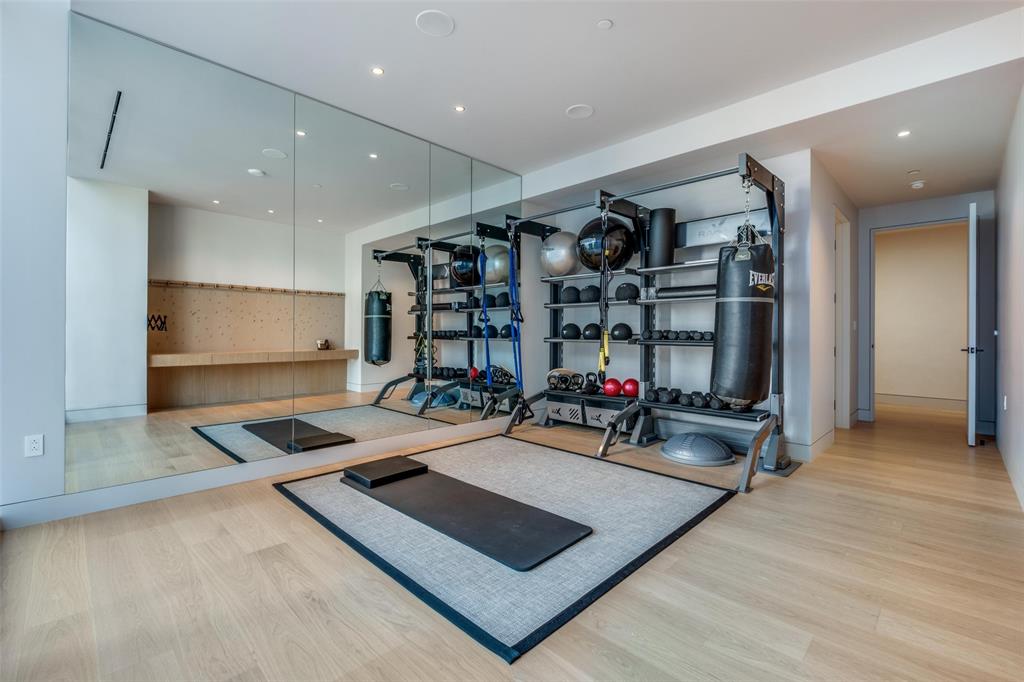 1747 Leonard Street, Unit 403 Dallas, TX 75201 - Photo 17 of 33 a view of a room with gym equipment