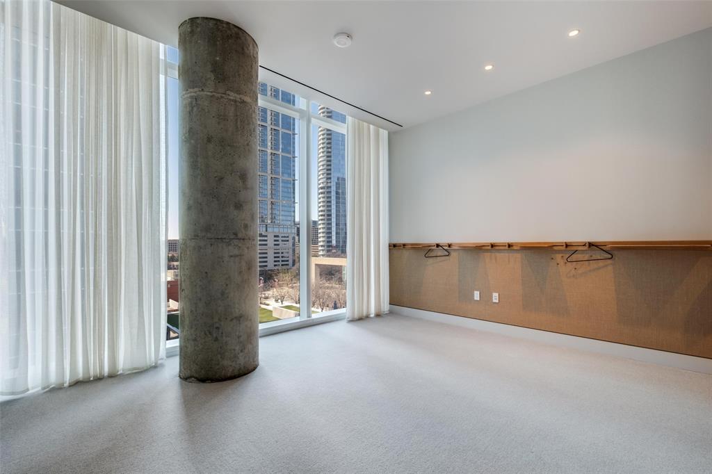 1747 Leonard Street, Unit 403 Dallas, TX 75201 - Photo 19 of 33 an empty room with windows