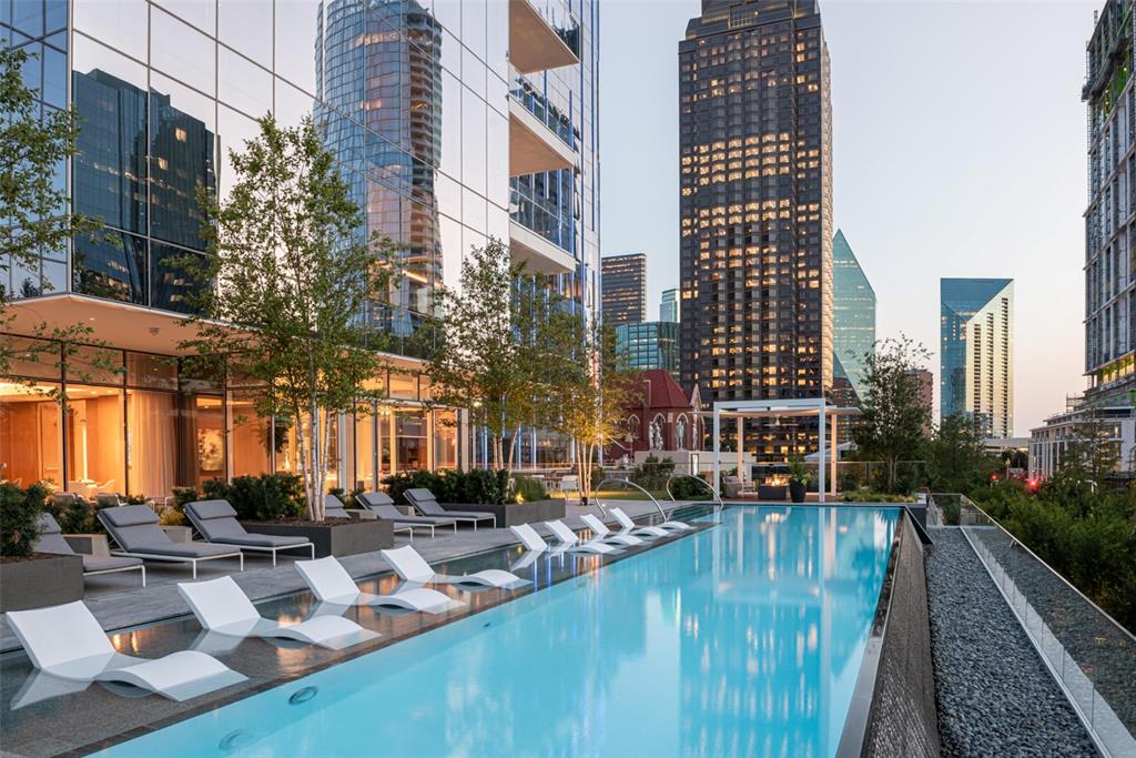 1747 Leonard Street, Unit 403 Dallas, TX 75201 - Photo 23 of 33 a view of swimming pool with outdoor seating and plants