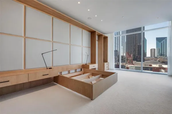 a large white kitchen with a large window