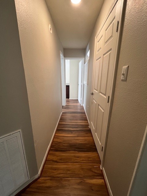 7719 Sign Street Houston, TX 77489 - Photo 5 of 7 a view of a hallway with wooden floor and staircase