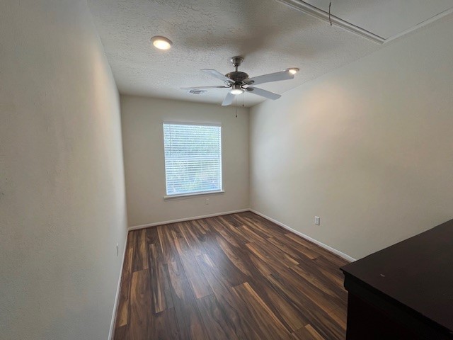 7719 Sign Street Houston, TX 77489 - Photo 6 of 7 an empty room with windows and ceiling fan
