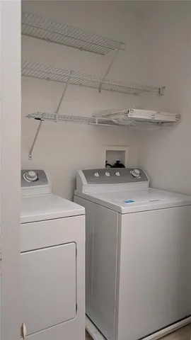 a view of a lake with a house in the background