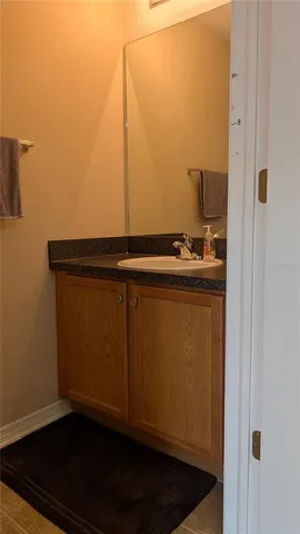 a room with water heater and a wooden floor