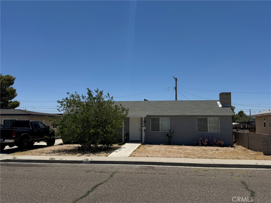 253 West French Avenue Ridgecrest, CA 93555 - Photo 1 of 1 a front view of a house with a yard