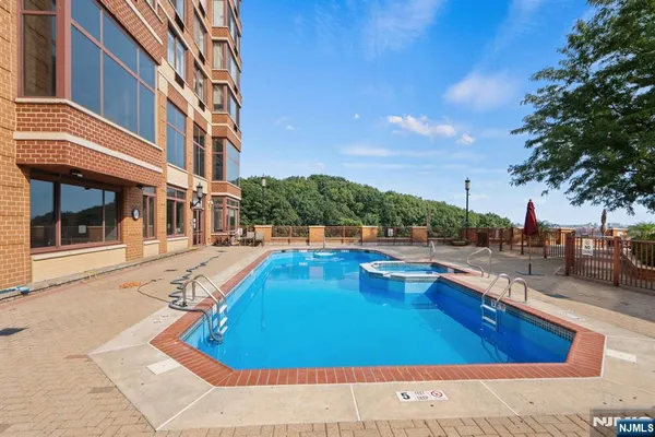 a view of a swimming pool with lounge chair