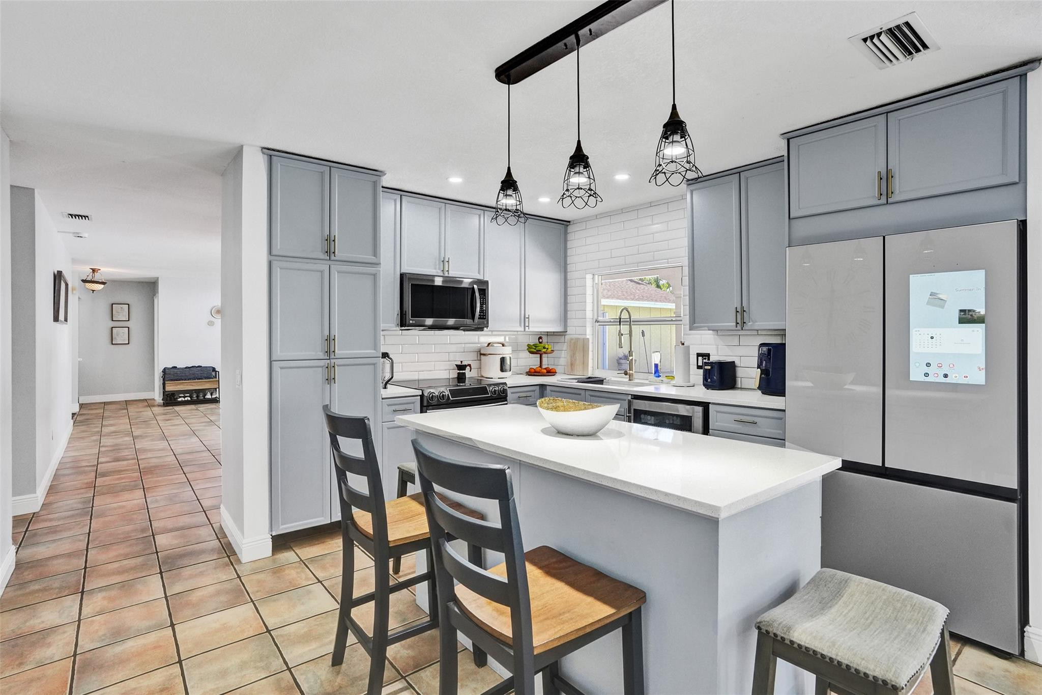 14930 Southwest 145th Street Miami, FL 33196 - Photo 15 of 93 Remodeled Kitchen and breakfast island