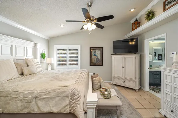 a bed room with furniture and a flat screen tv