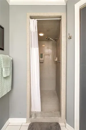 a bathroom with a glass shower door