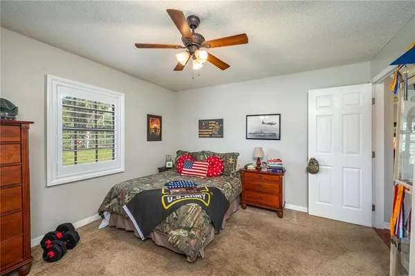 a bedroom with bed and window