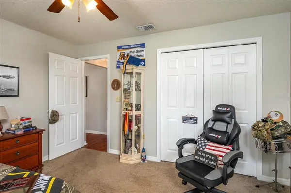 a bathroom with a toilet a sink and a mirror