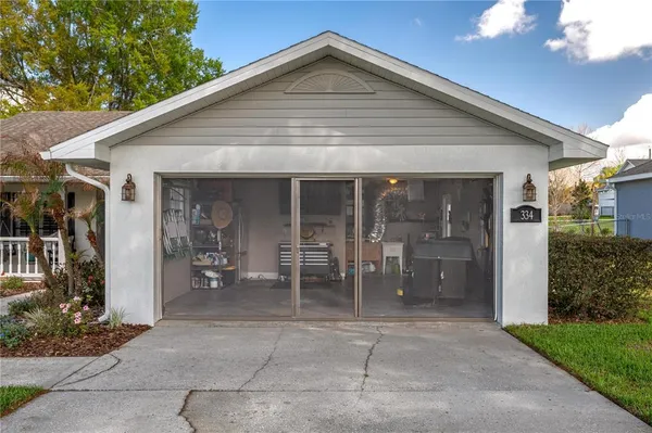 a view of a park with iron fence