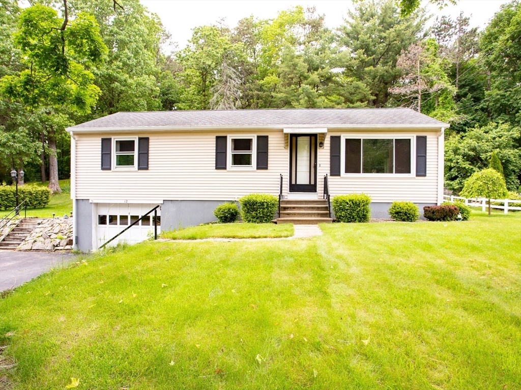 a view of a house with swimming pool and a yard