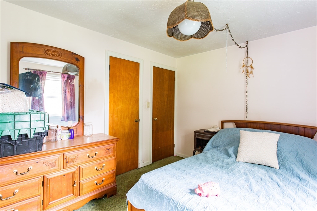 12 Hadley Path West Brookfield, MA 01585 - Photo 16 of 28 a bedroom with a bed and a dresser
