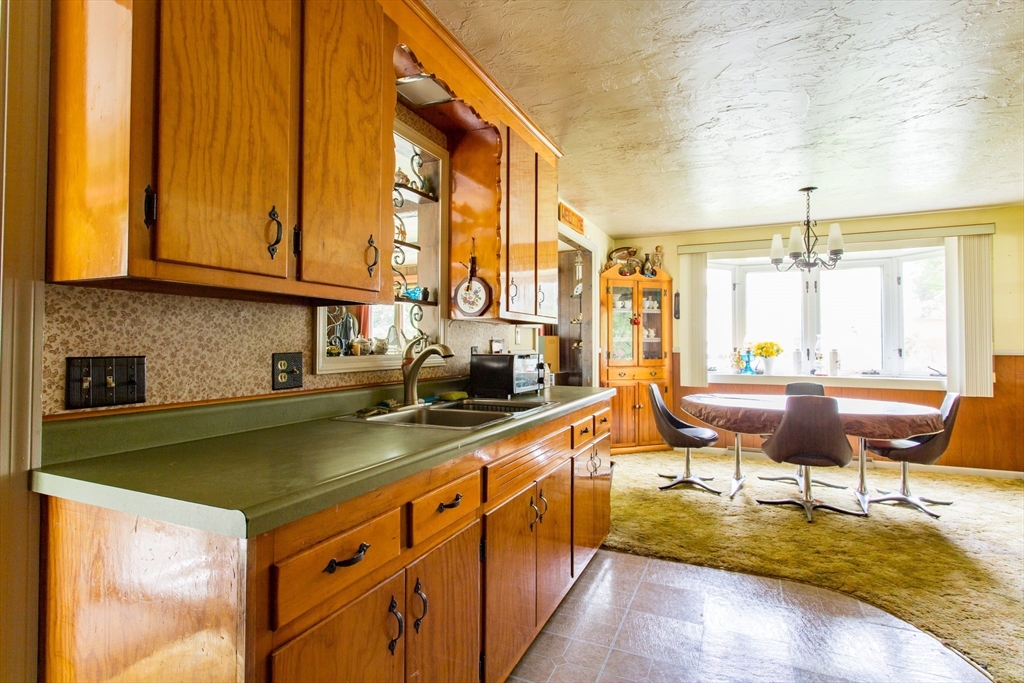 12 Hadley Path West Brookfield, MA 01585 - Photo 4 of 28 a kitchen with stainless steel appliances granite countertop sink stove and cabinets