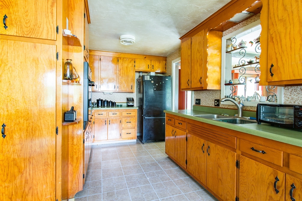 12 Hadley Path West Brookfield, MA 01585 - Photo 7 of 28 a kitchen with stainless steel appliances granite countertop a refrigerator and a sink
