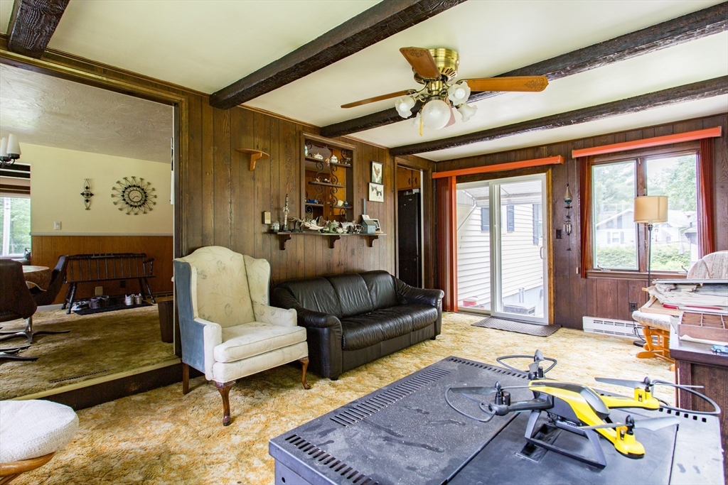 12 Hadley Path West Brookfield, MA 01585 - Photo 10 of 28 a living room with furniture and a table
