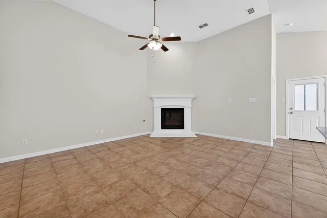 a large kitchen with cabinets and stainless steel appliances