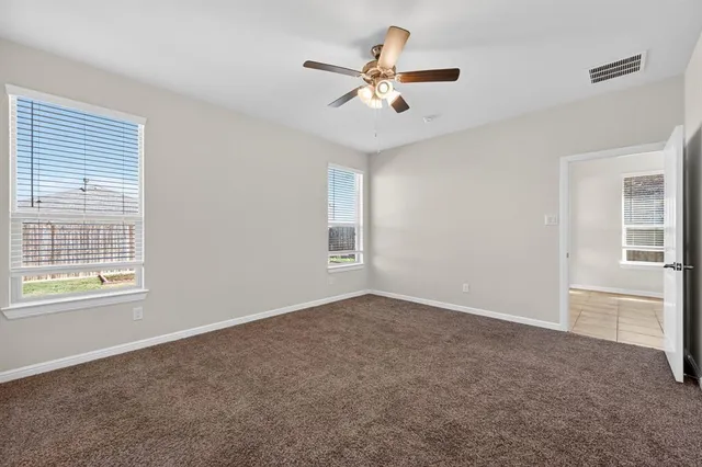 a view of an empty room with a fireplace