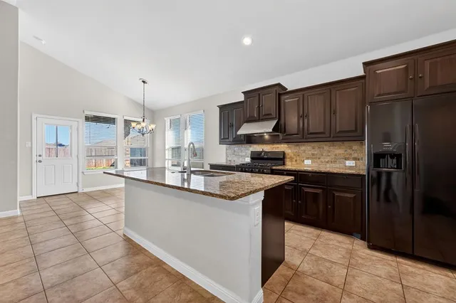 a view of an empty room with a fireplace