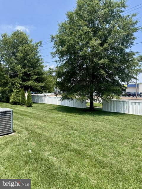 26497 Thunder Road Millsboro, DE 19966 - Photo 29 of 30 Lush green yard with vibrant trees.