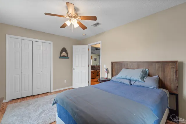 a bathroom with a sink toilet a mirror a vanity and shower